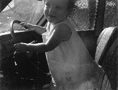 Katherine (Kat) McDougal Wheeler McCandless; driving car in Saipan christmas card to Mrs Offut